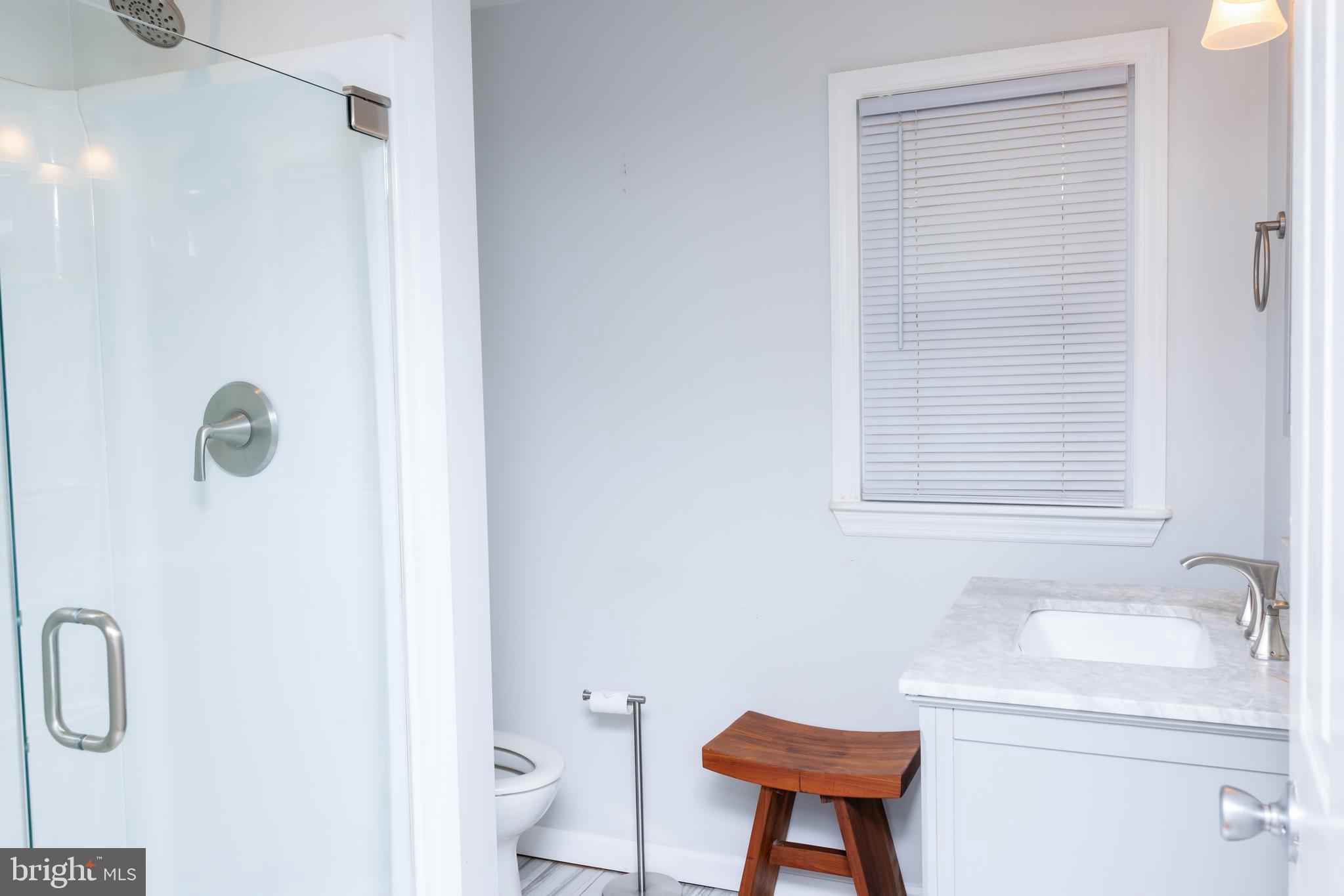 41 Plymouth Road Sicklerville, NJ 08081 - Photo 7 of 30 a bathroom with a sink a toilet and a mirror
