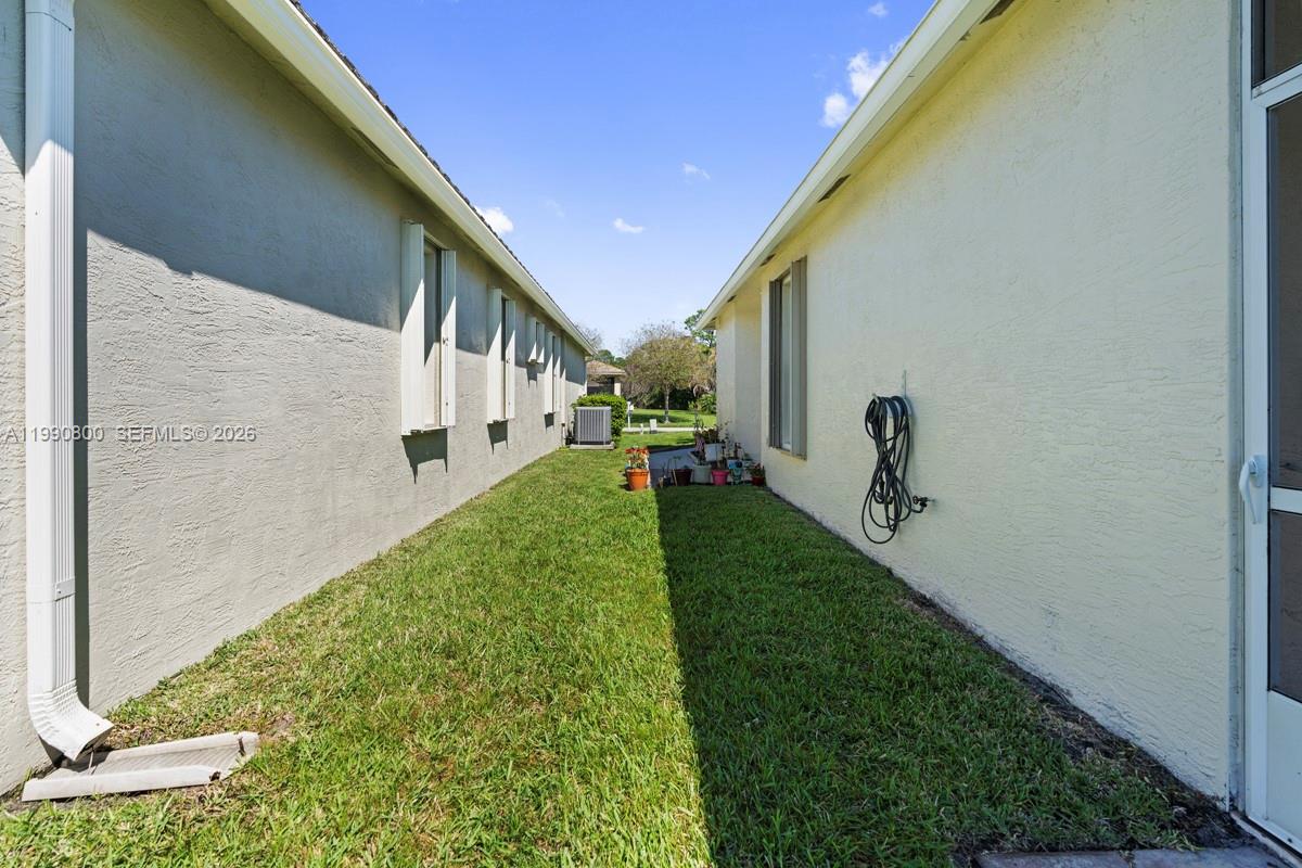 337 Southwest Maclay Way Port St. Lucie, FL 34986 - Photo 38 of 44 a view of a back yard of the house