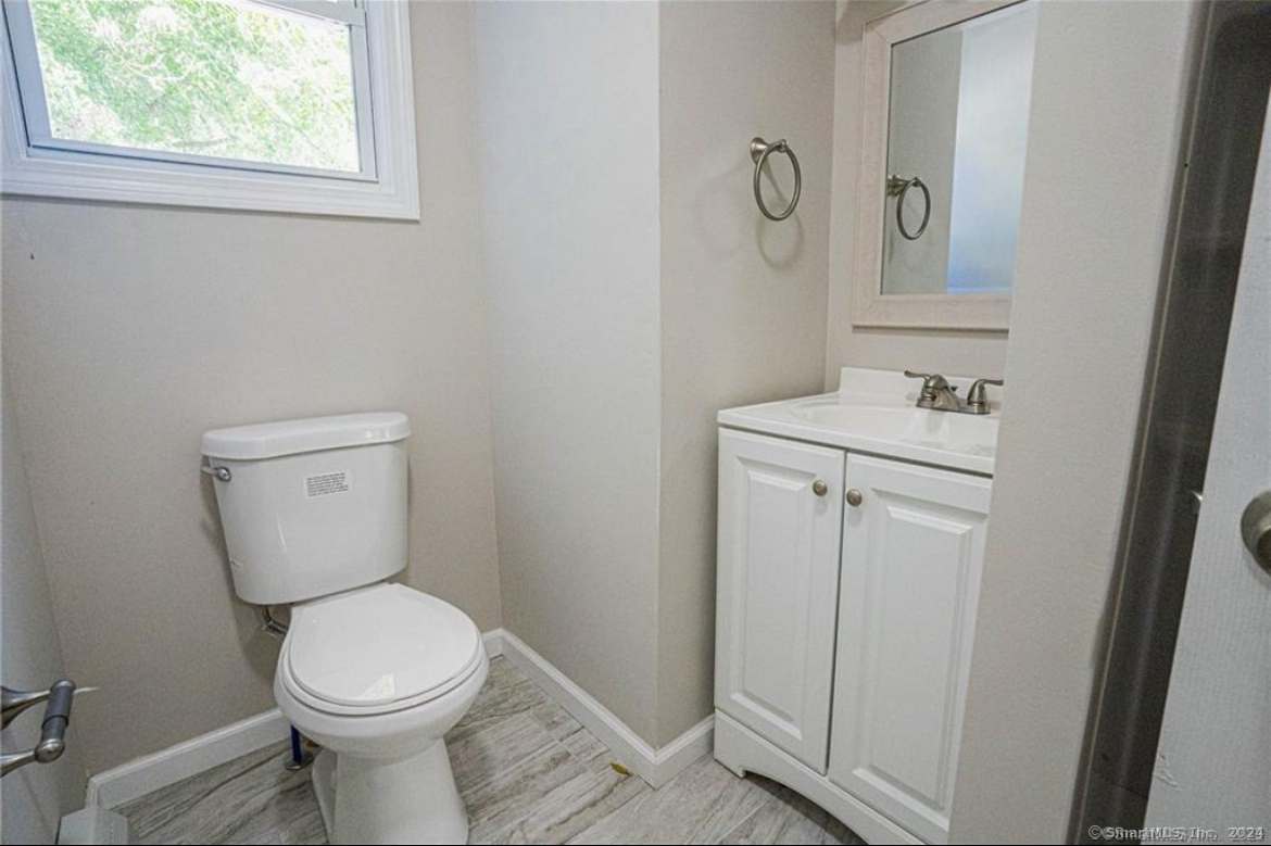 34 Sisson Avenue Hartford, CT 06106 - Photo 12 of 35 a bathroom with a toilet a sink and mirror