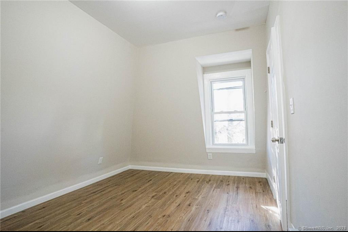 34 Sisson Avenue Hartford, CT 06106 - Photo 14 of 35 an empty room with wooden floor and windows