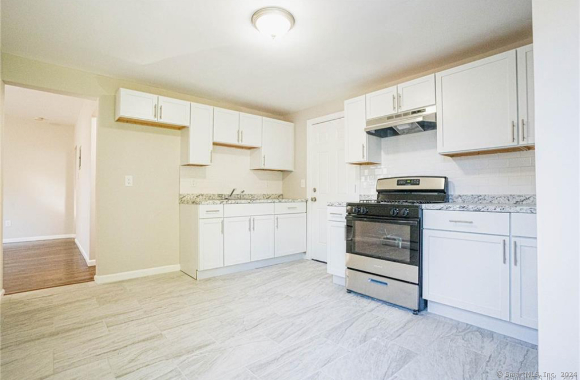 34 Sisson Avenue Hartford, CT 06106 - Photo 23 of 35 a kitchen with white cabinets and appliances