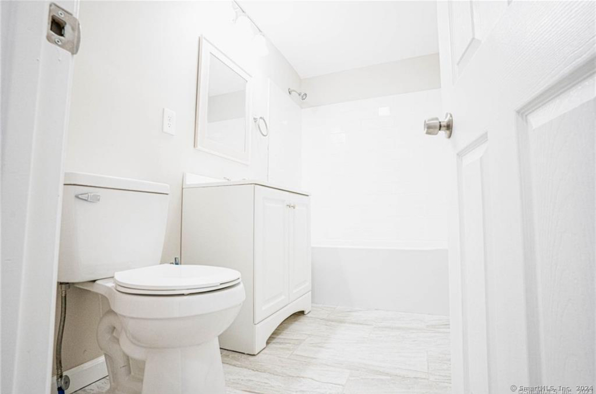 34 Sisson Avenue Hartford, CT 06106 - Photo 26 of 35 a bathroom with a toilet and a shower