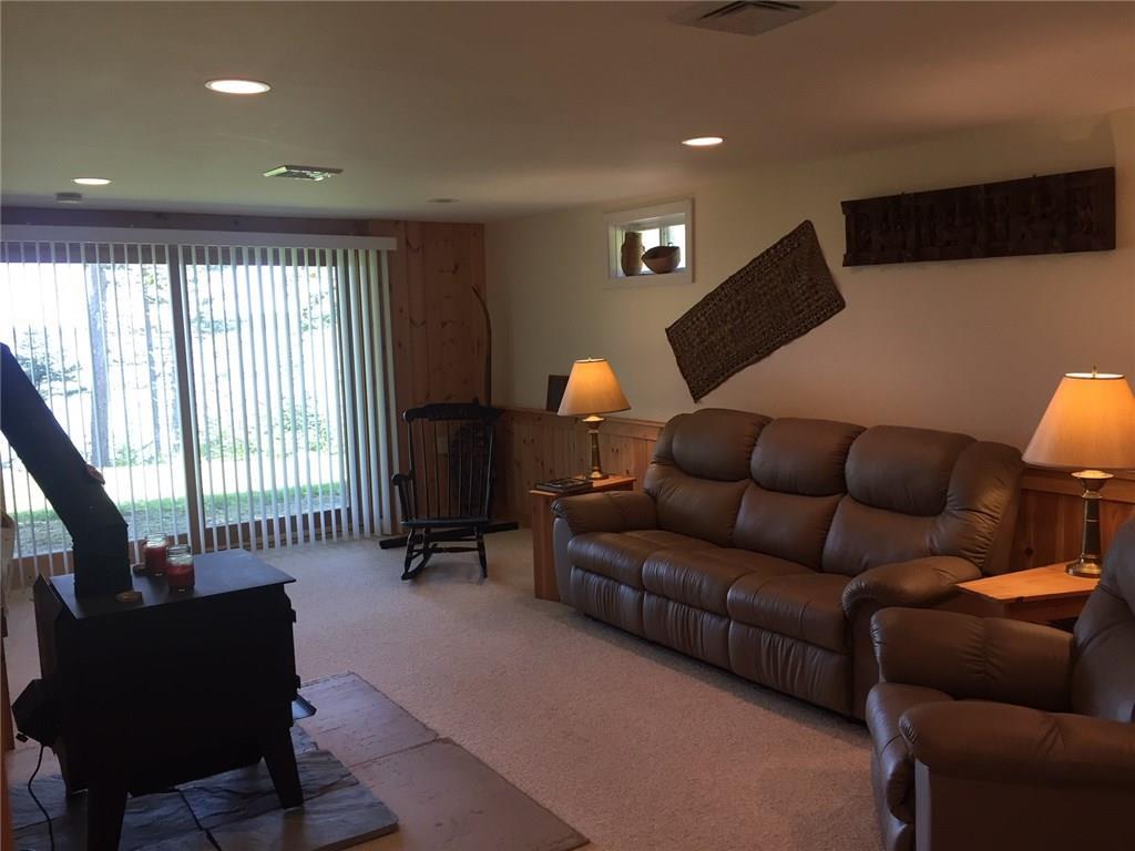 325 Ripley Road Harrington, ME 04643 - Photo 16 of 22 Basement living room with woodstove