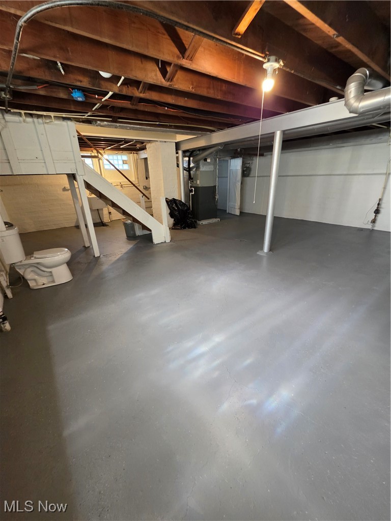 12813 North Road Cleveland, OH 44111 - Photo 23 of 30 Unfinished below grade area with stairway and heating unit