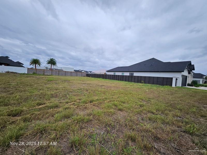 1007 Wesley Street Pharr, TX 78577 - Photo 2 of 6 a view of a house with a yard and a large tree center in it