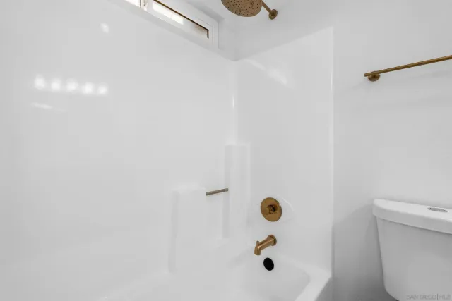 a kitchen with stainless steel appliances a stove microwave and sink