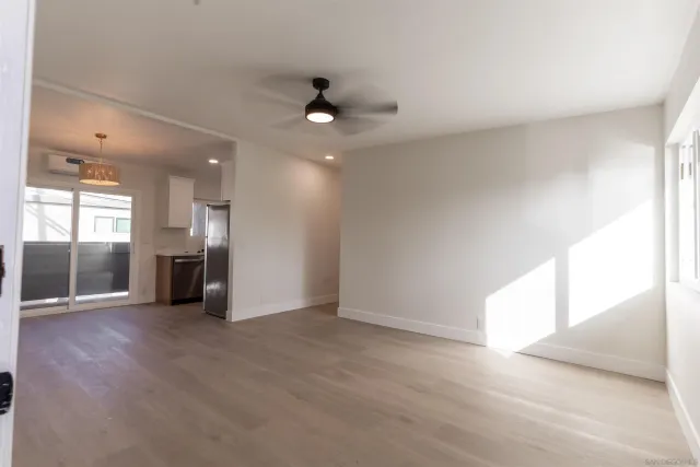 a view of hallway with wooden floor