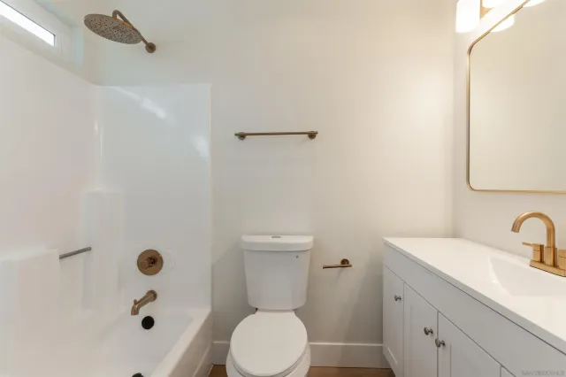 a kitchen with stainless steel appliances granite countertop a refrigerator sink and stove