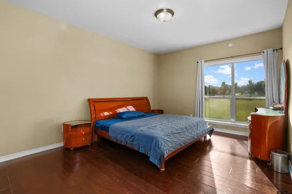 a large kitchen with a large window and kitchen view