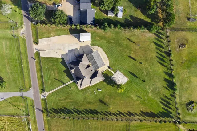 a view of a swimming pool and lounge chair