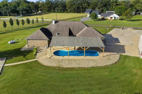 a view of a house with a big yard