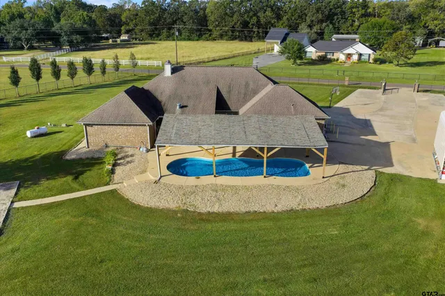 a view of a house with a big yard