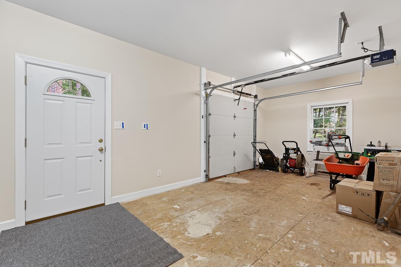 2113 Tibwin Drive Raleigh, NC 27606 - Photo 23 of 30 In addition to the attached garage, there is a detached garage/workshop with a second bonus room above.