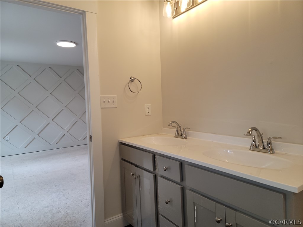 12013 Corte Castle Road Chesterfield, VA 23838 - Photo 18 of 43 a bathroom with a sink and a mirror
