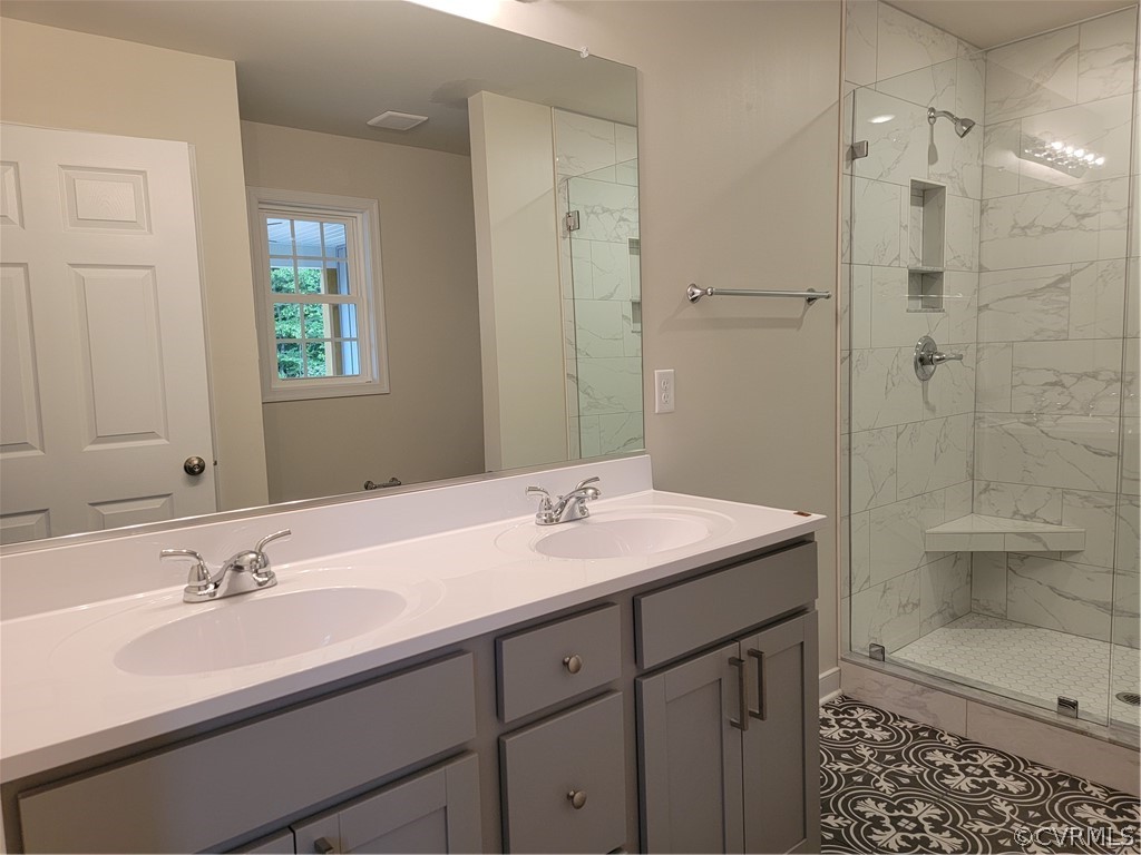 12013 Corte Castle Road Chesterfield, VA 23838 - Photo 24 of 43 a bathroom with a sink double vanity and a shower