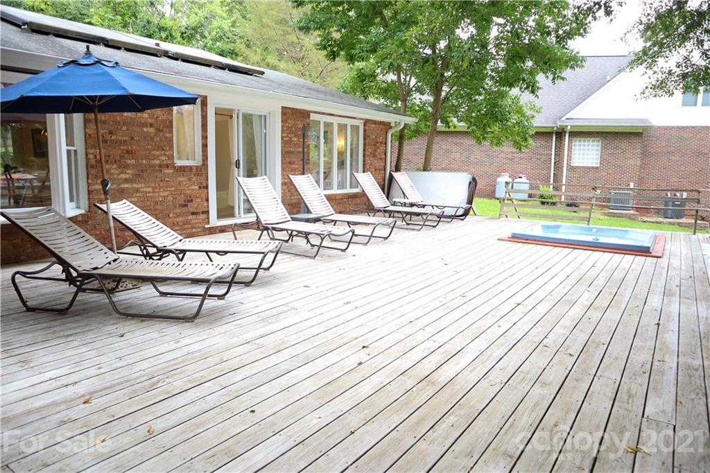 3956 Lake Shore Road South Denver, NC 28037 - Photo 32 of 44 a view of a patio with wooden floor table and chairs