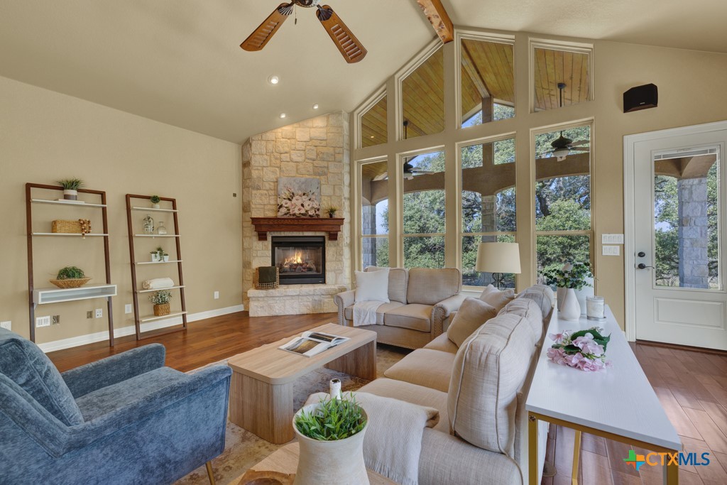7607 Sky Loop Garden Ridge, TX 78266 - Photo 14 of 43 a living room with furniture fireplace and a large window