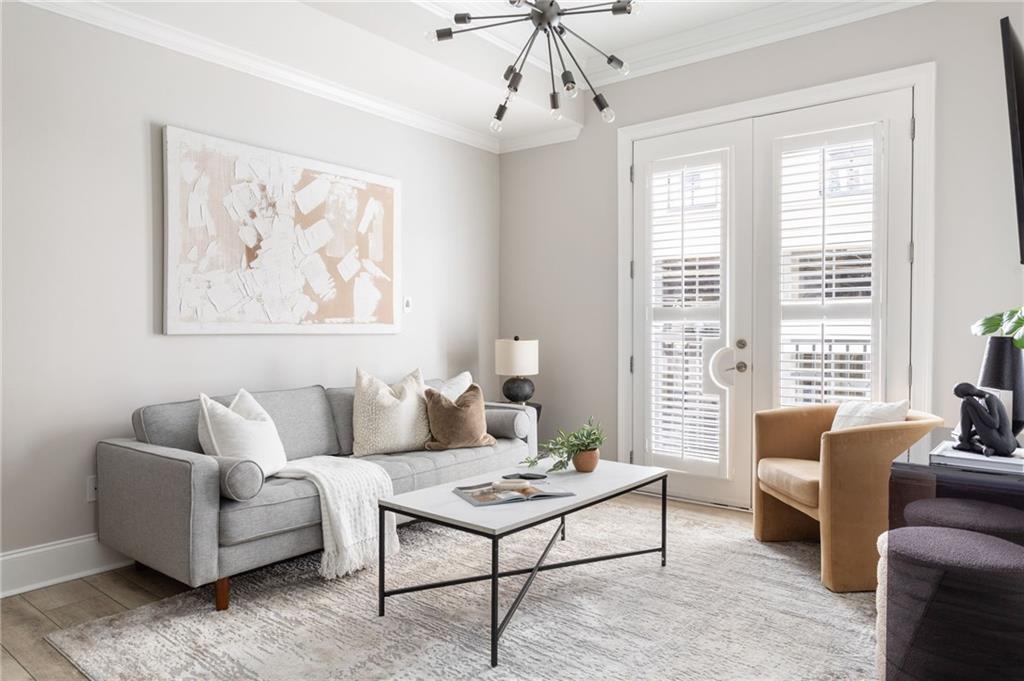 2255 Peachtree Road Northeast, Unit 326 Atlanta, GA 30309 - Photo 5 of 37 a living room with furniture and a large window