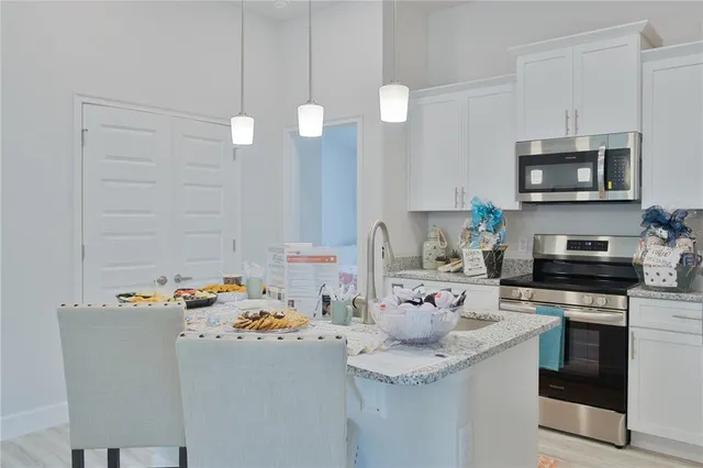 a kitchen that has a sink and a stove