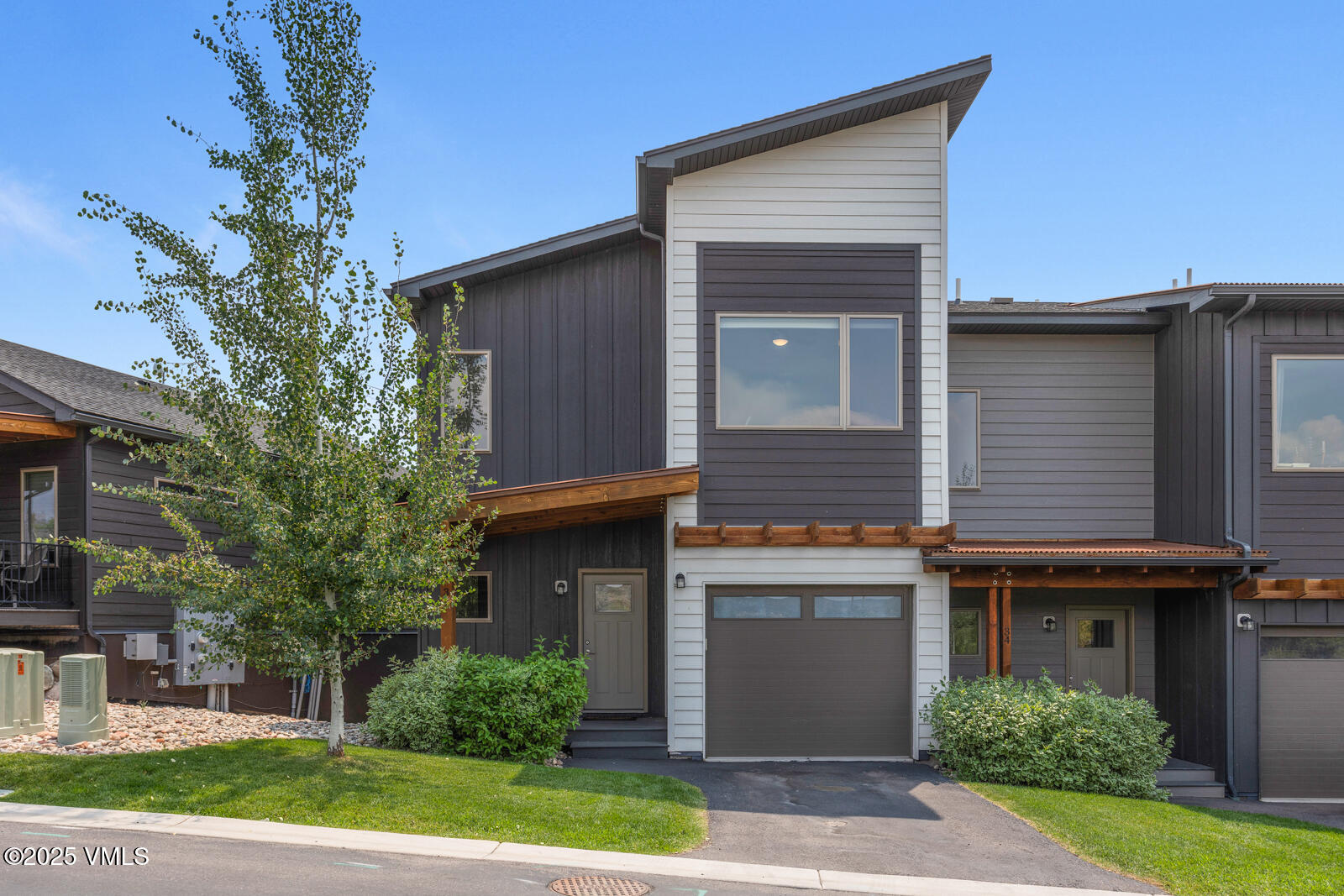 32 Flat Tops Court, Unit L3 Eagle, CO 81631 - Photo 1 of 28 a front view of a house with garden