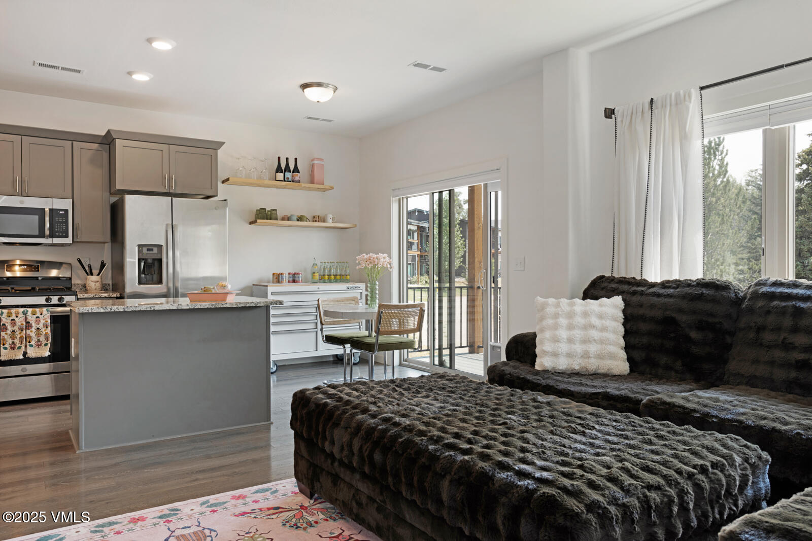 32 Flat Tops Court, Unit L3 Eagle, CO 81631 - Photo 11 of 28 a bedroom with a bed and wooden floor