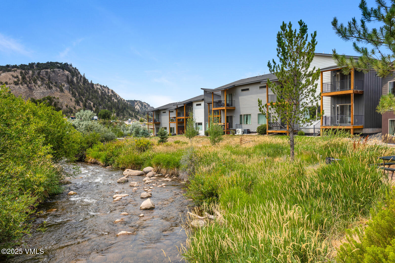 32 Flat Tops Court, Unit L3 Eagle, CO 81631 - Photo 14 of 28 a front view of a house with a yard