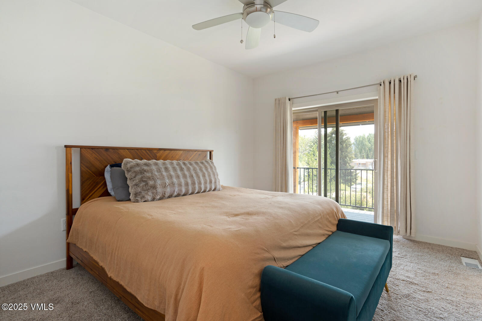 32 Flat Tops Court, Unit L3 Eagle, CO 81631 - Photo 15 of 28 a large bed sitting in a bedroom next to a window