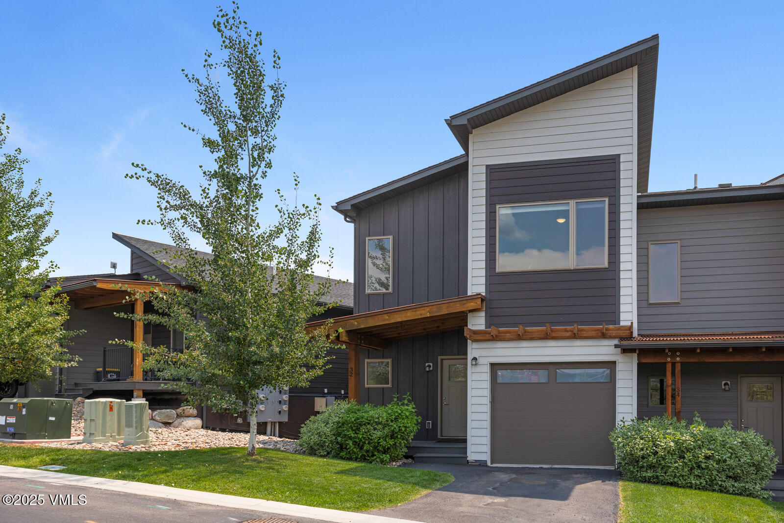 32 Flat Tops Court, Unit L3 Eagle, CO 81631 - Photo 25 of 28 a house that has a tree in front of it