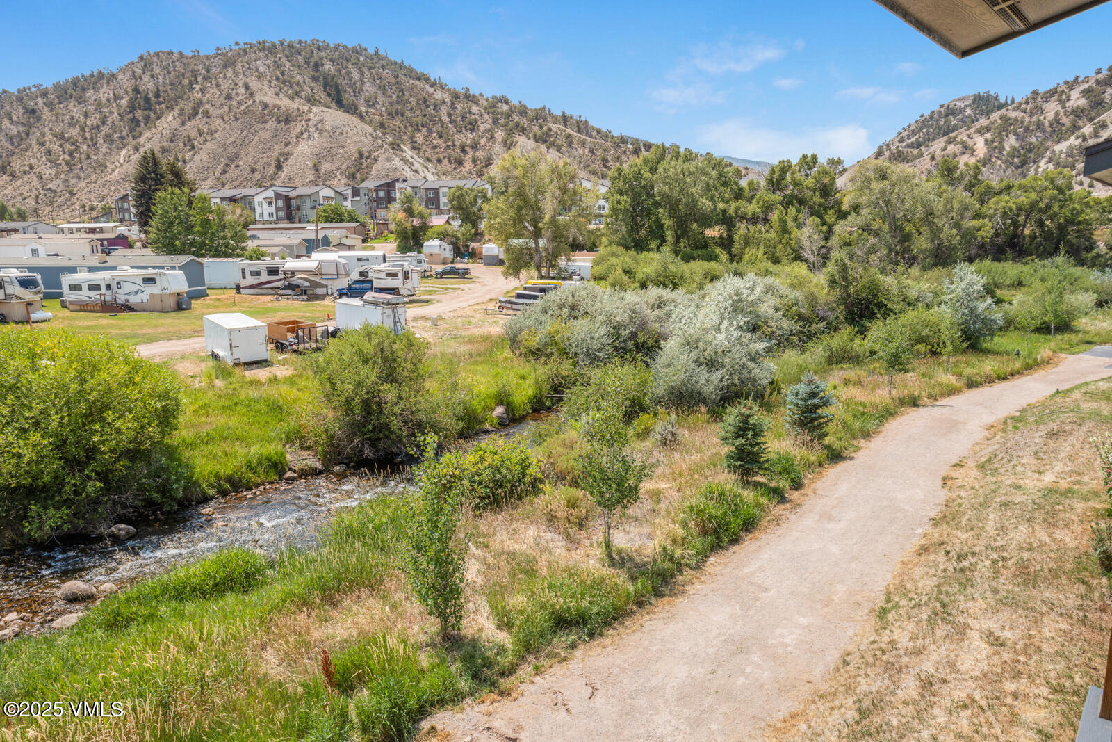 32 Flat Tops Court, Unit L3 Eagle, CO 81631 - Photo 28 of 28 a view of a lake with a mountain in the background
