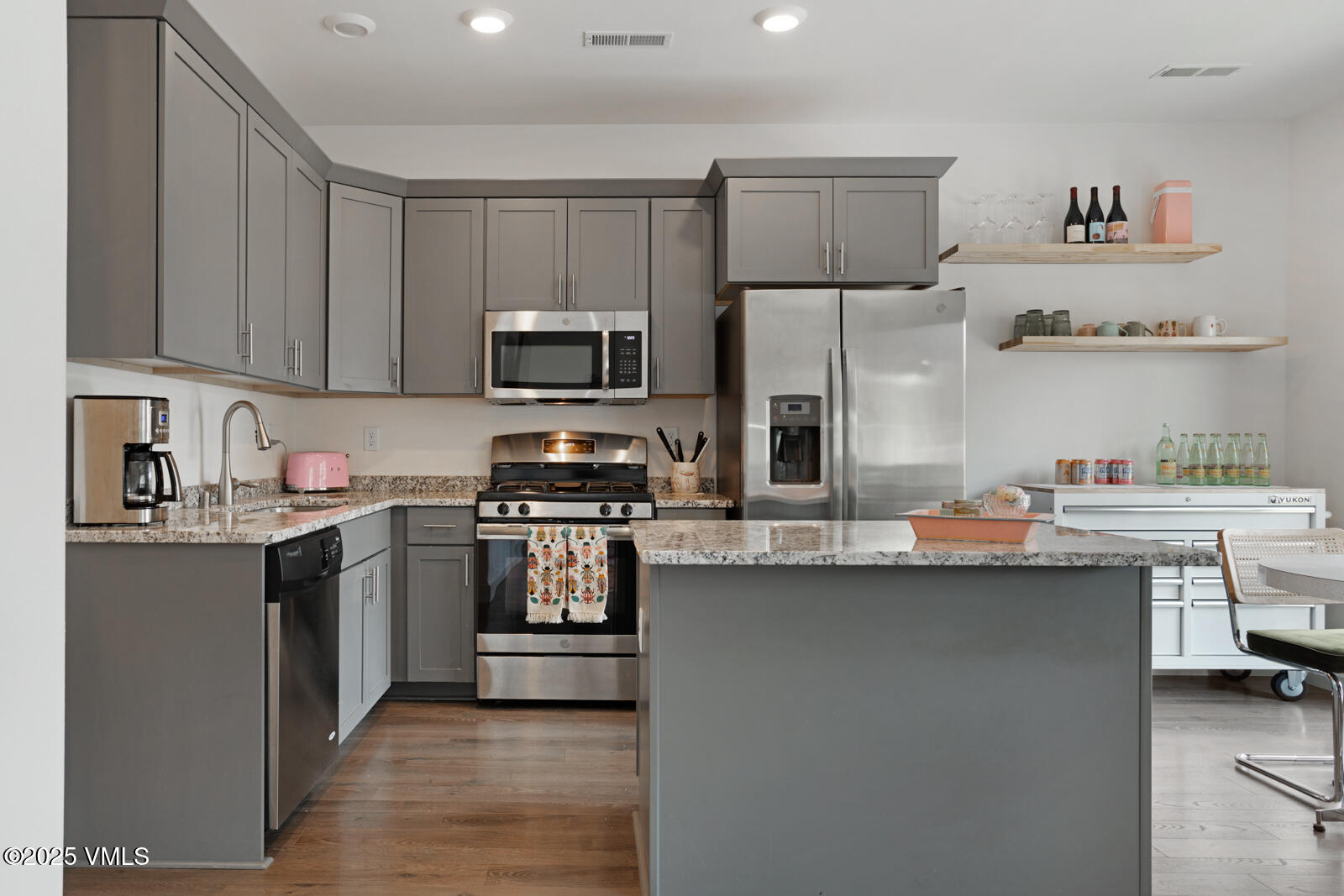 32 Flat Tops Court, Unit L3 Eagle, CO 81631 - Photo 4 of 28 a kitchen with stainless steel appliances a sink stove refrigerator and cabinets