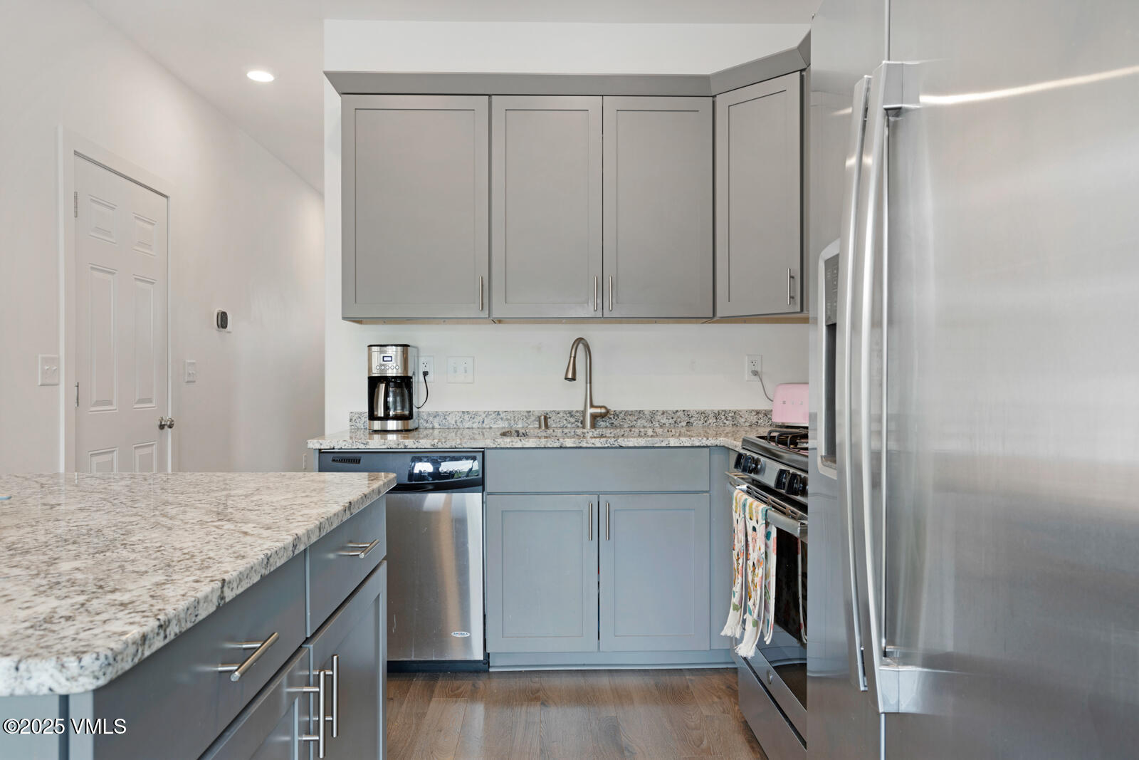 32 Flat Tops Court, Unit L3 Eagle, CO 81631 - Photo 7 of 28 a kitchen with a sink refrigerator and cabinets