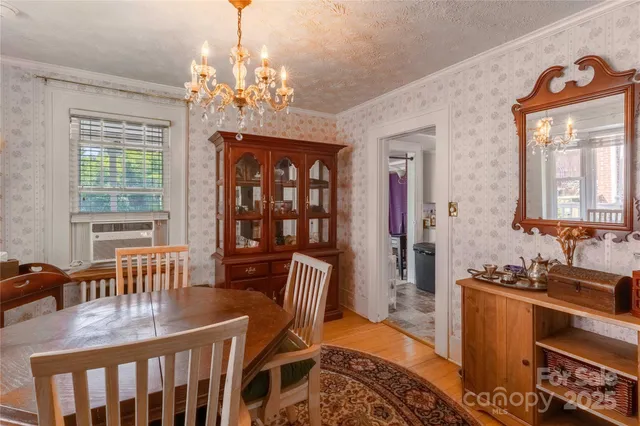 a kitchen with stainless steel appliances a stove a sink cabinets and a window