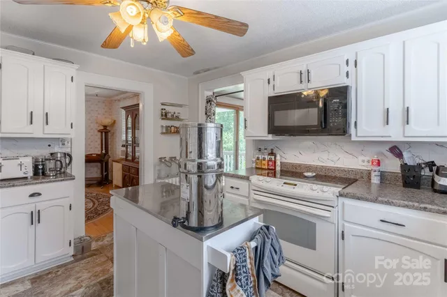 a kitchen with counter top space cabinets and appliances