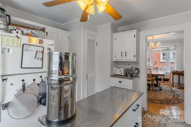 a kitchen with a sink cabinets and appliances