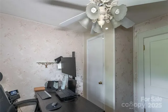 a bedroom with bed and a window