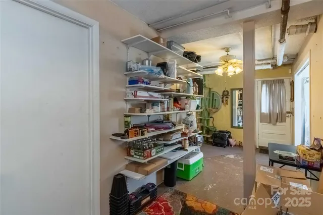 a view of a livingroom with furniture and windows