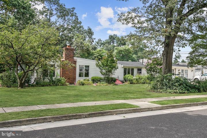 323 Palmer Street Riverside, NJ 08075 - Photo 1 of 30 a front view of a house with a yard and trees