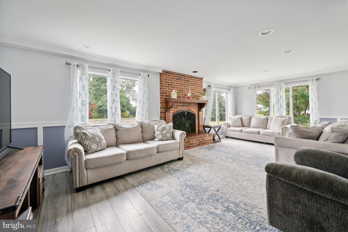 323 Palmer Street Riverside, NJ 08075 - Photo 11 of 30 a living room with furniture and a fireplace