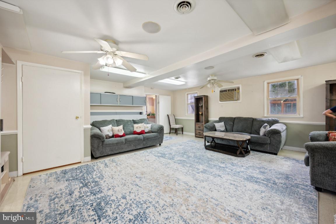 323 Palmer Street Riverside, NJ 08075 - Photo 14 of 30 a living room with furniture and a chandelier