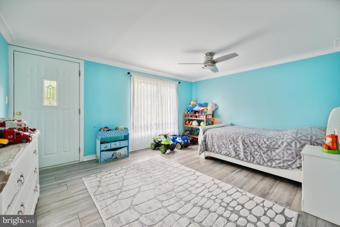 323 Palmer Street Riverside, NJ 08075 - Photo 21 of 30 a bedroom with a bed and a window