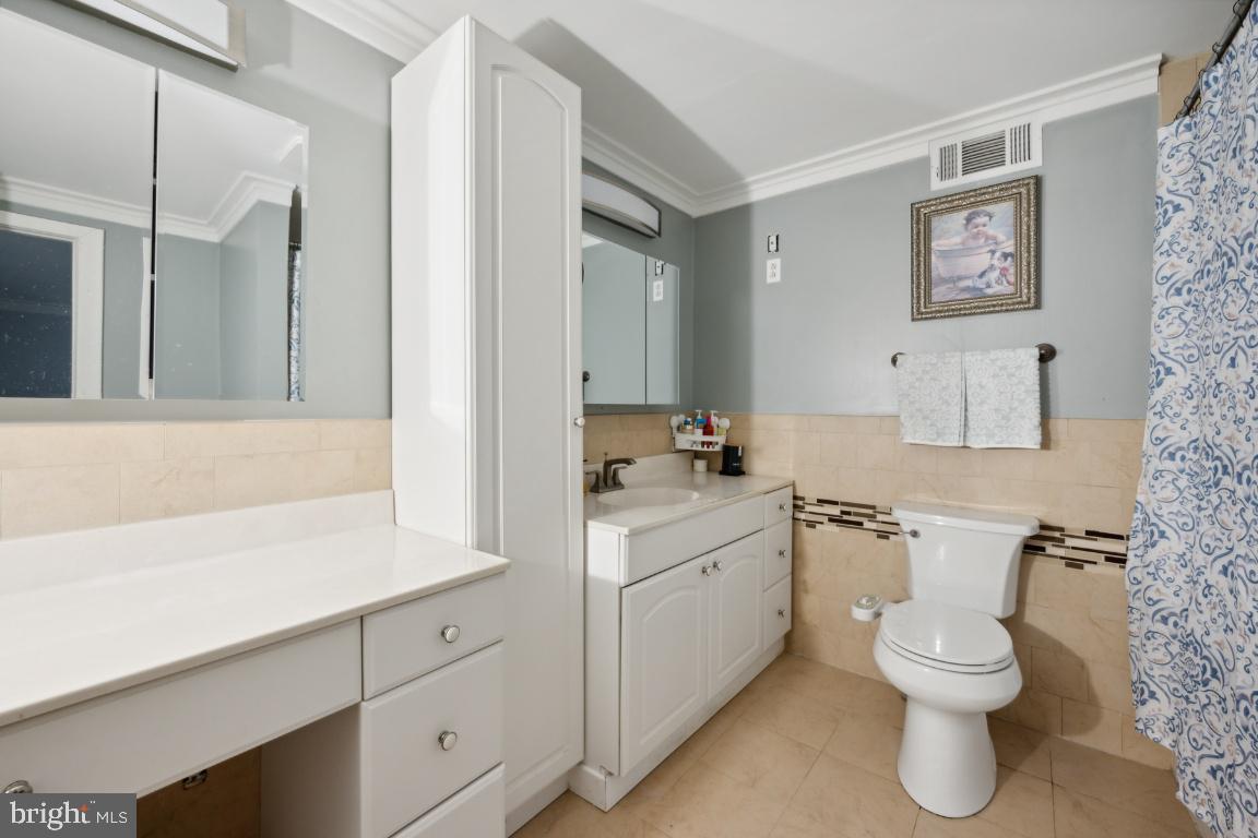 323 Palmer Street Riverside, NJ 08075 - Photo 22 of 30 a bathroom with a toilet sink and mirror