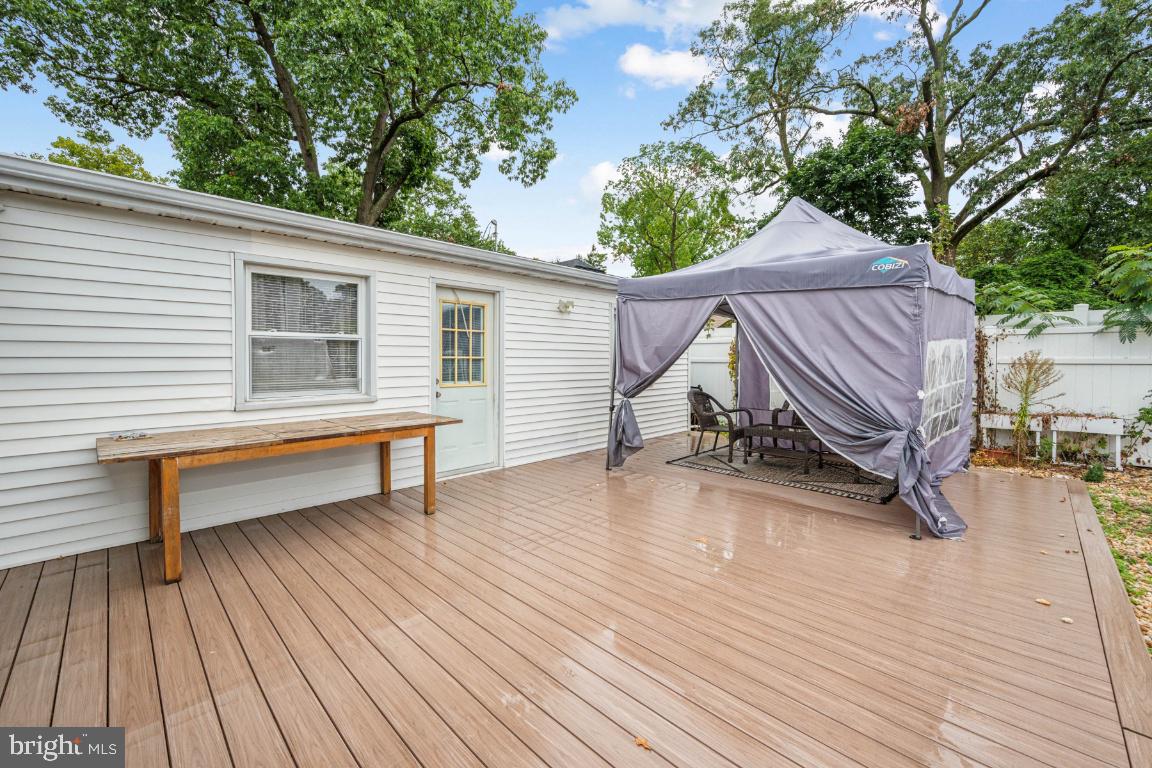 323 Palmer Street Riverside, NJ 08075 - Photo 24 of 30 a view of a roof deck with wooden floor and seating space