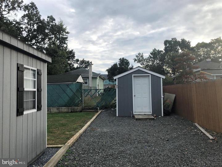 323 Palmer Street Riverside, NJ 08075 - Photo 25 of 30 a view of a house with backyard and tree
