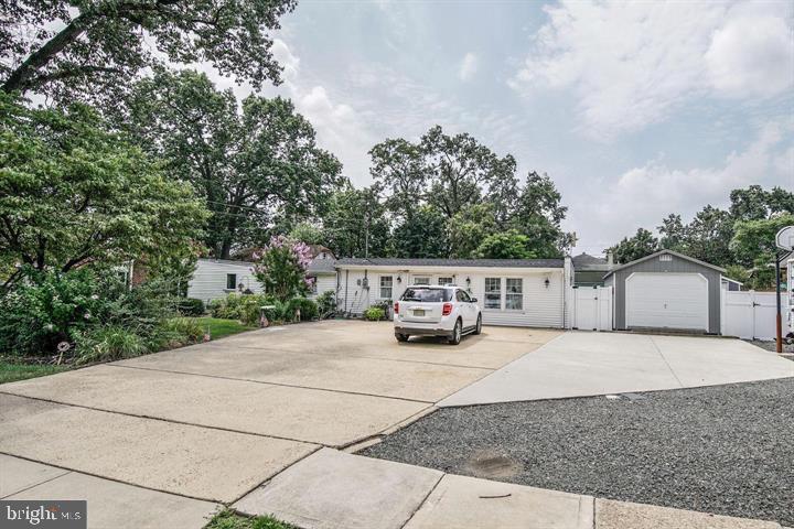323 Palmer Street Riverside, NJ 08075 - Photo 26 of 30 a view of the house with outdoor space and trees in the background