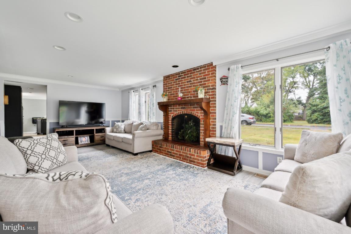 323 Palmer Street Riverside, NJ 08075 - Photo 10 of 30 a living room with furniture large window and a fireplace