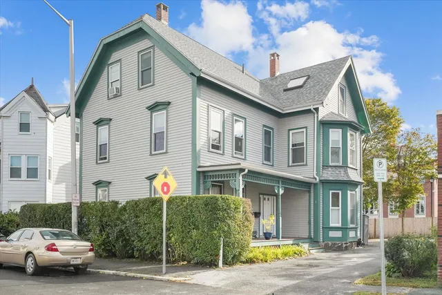 a front view of a house with parking