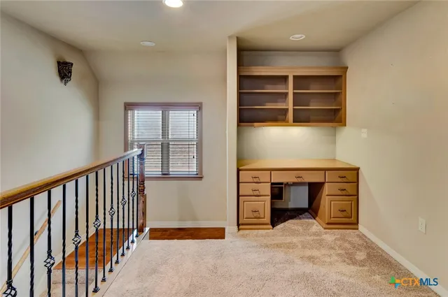 a view of room with window and shelf