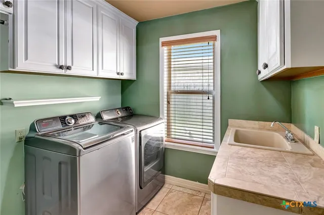 a room with washing machine and window