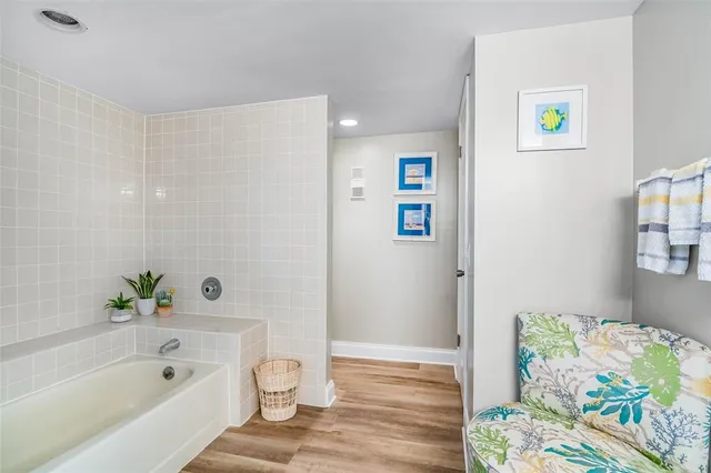 a bathroom with a bathtub and a shower