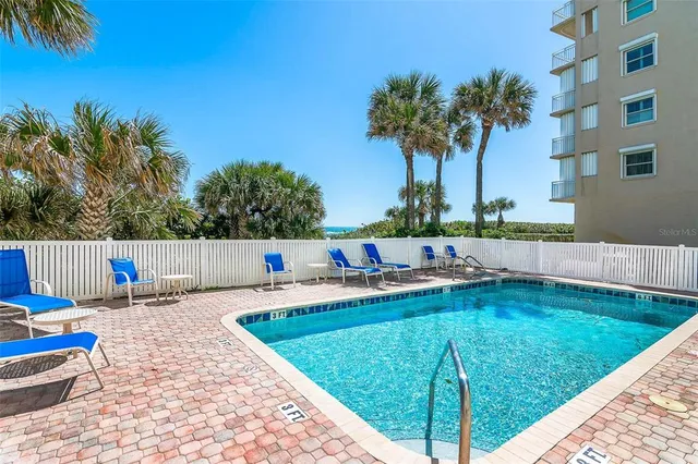 a front view of a building with garden